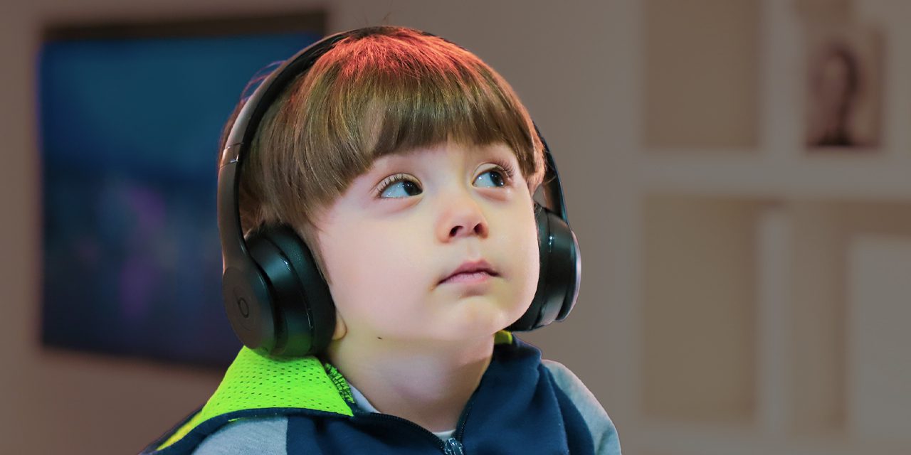 child wearing a headphones