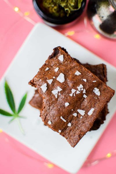 closeup of cannabis brownies on white plate