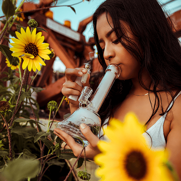 young woman inhaling cannabis