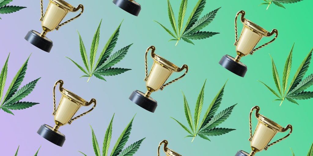 sativa and indica leaf, trophy on a purple/green gradient background
