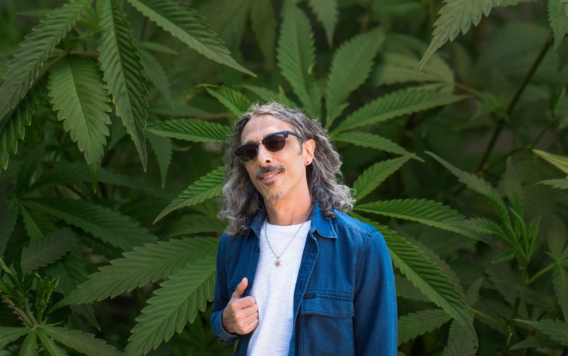 Kyle Kushan over marijuana as background