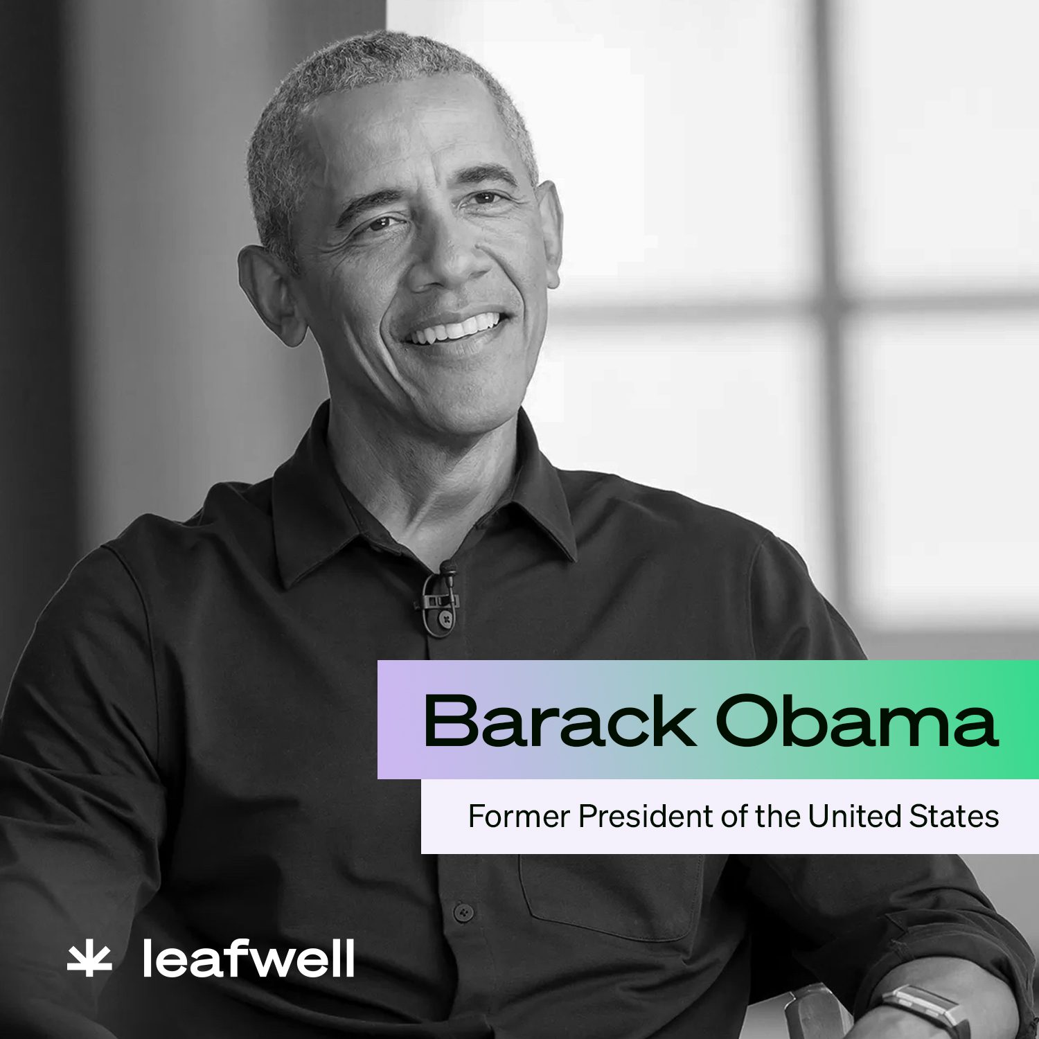 Former Pres Barack Obama sitting with a smile