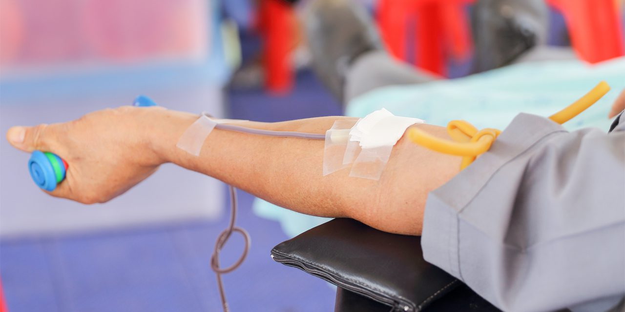 closeup of arm donating blood