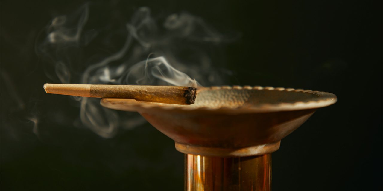 cannabis joint above an ashtray