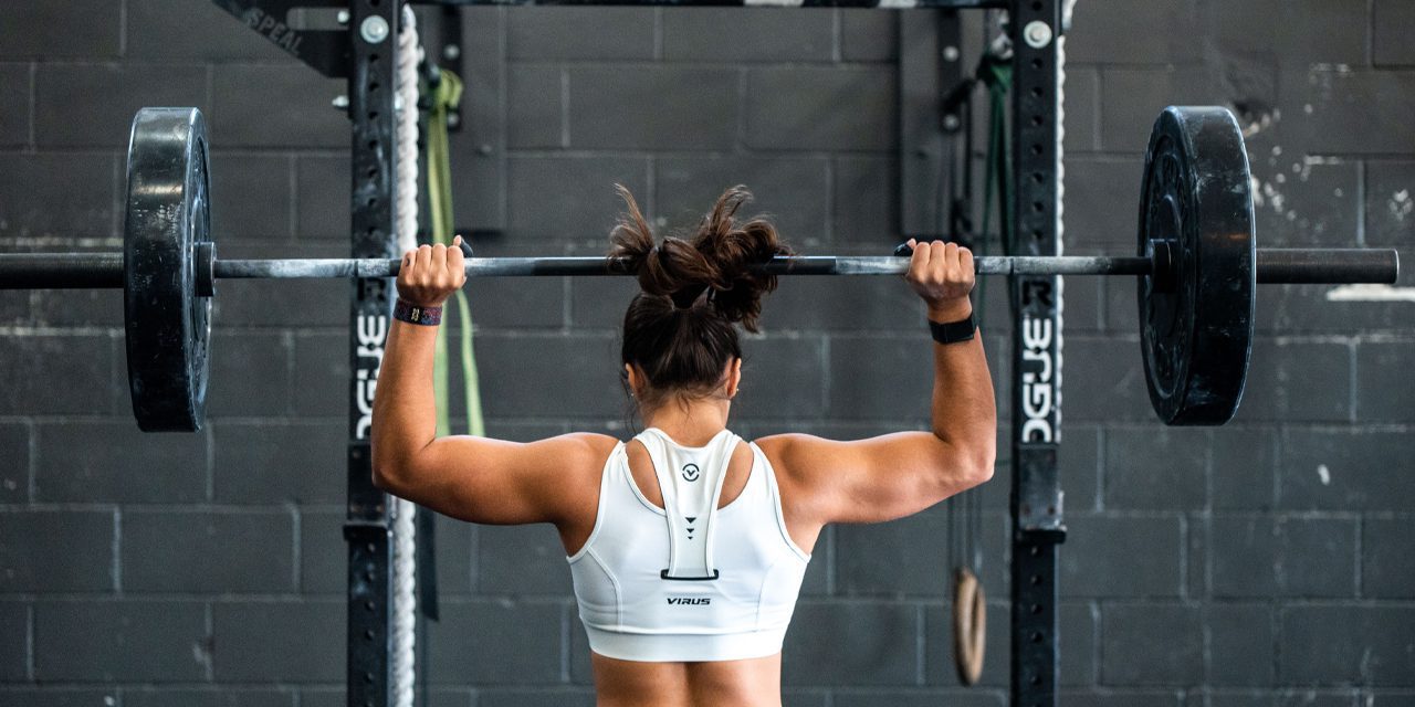 a woman doing weight lifting