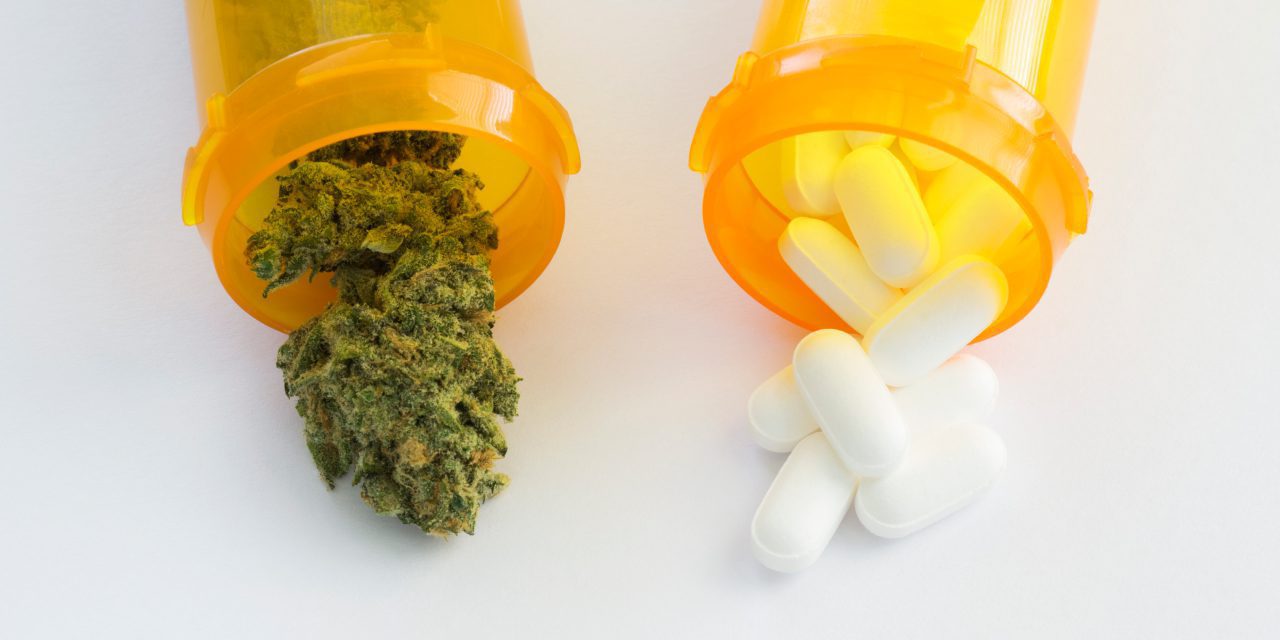 medical marijuana and medicine capsules in a separate prescription bottles