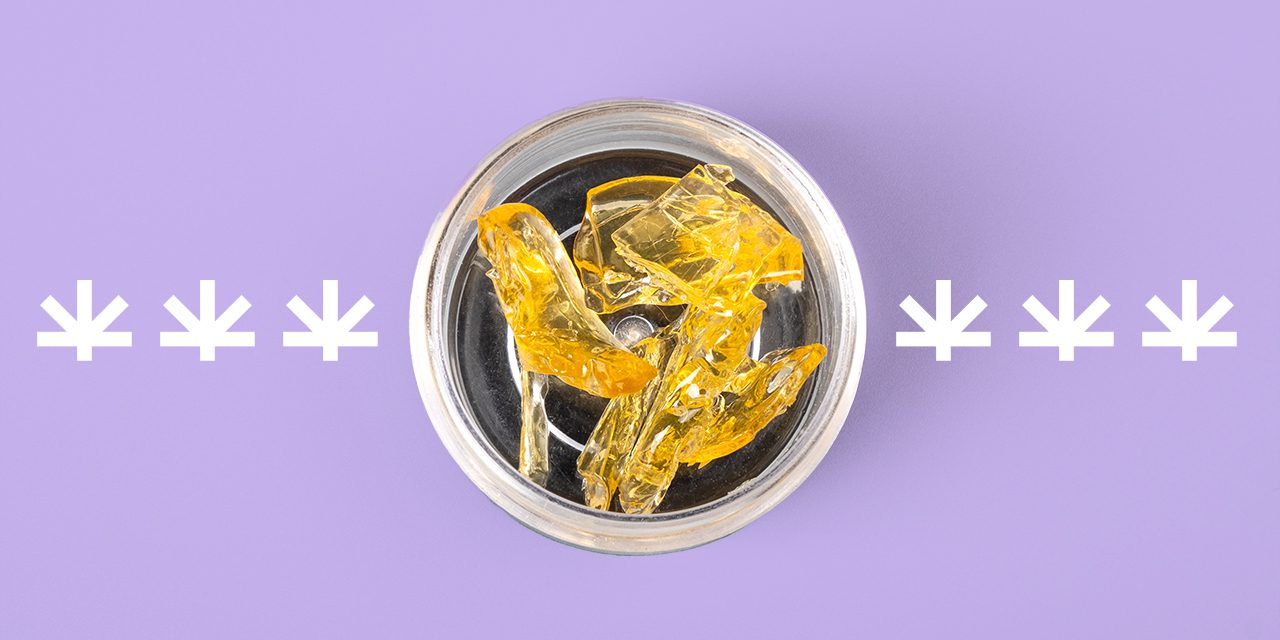 golden cannabis wax pieces shatter resin in a clear small container